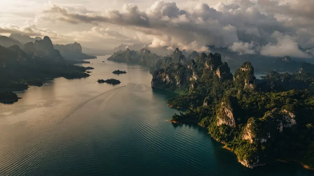 Aerial view of the lake at dusk with clouds over karst ridges