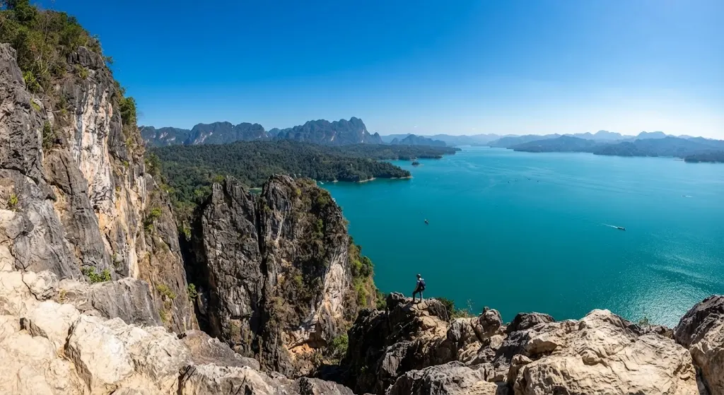 Limestone viewpoint overlooking a wide turquoise lake