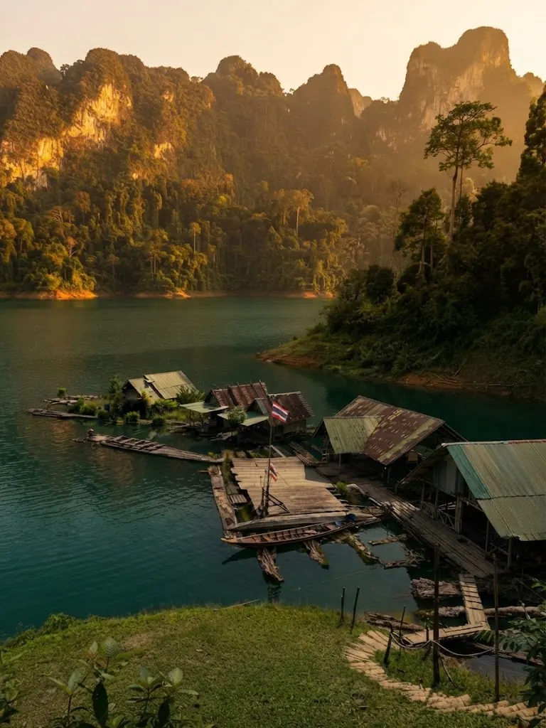 Small raft house cluster in a lake inlet at golden hour