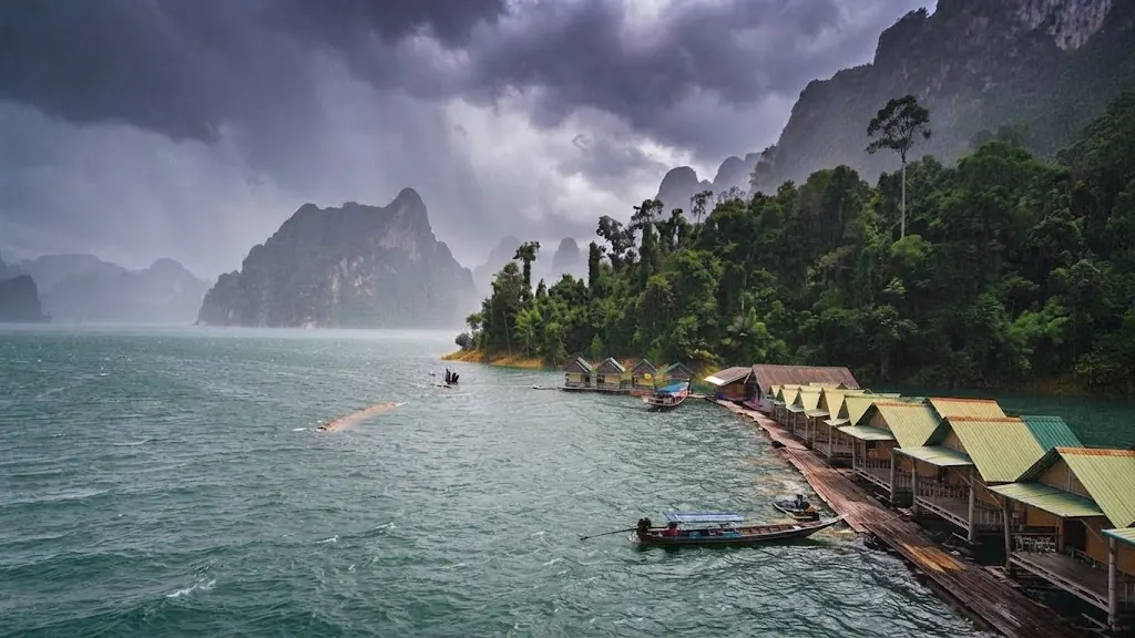 Rainstorm approaching a row of raft houses on Cheow Lan Lake