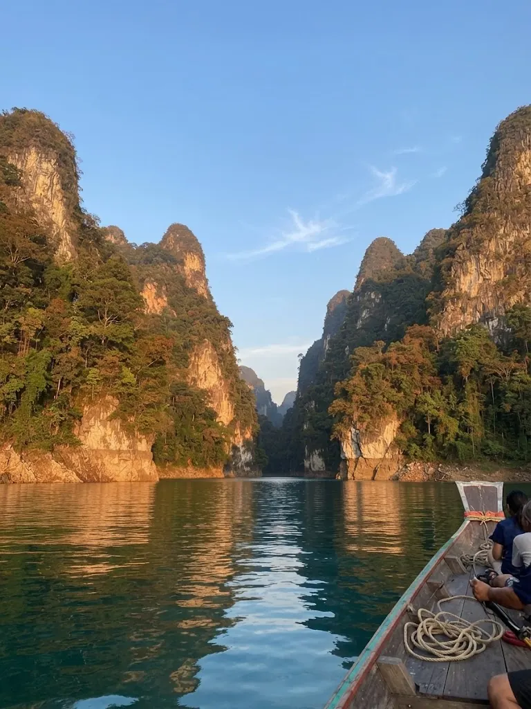 View from a long-tail boat between limestone cliffs